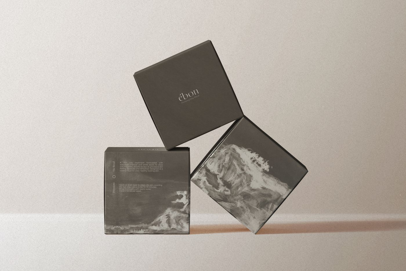 Ébon skincare packaging boxes arranged against a neutral background.