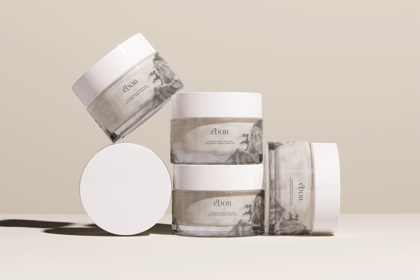 Ébon clay mask jars arranged in a balanced product composition.